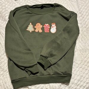 Green Holiday Sweatshirt with Festive Graphics